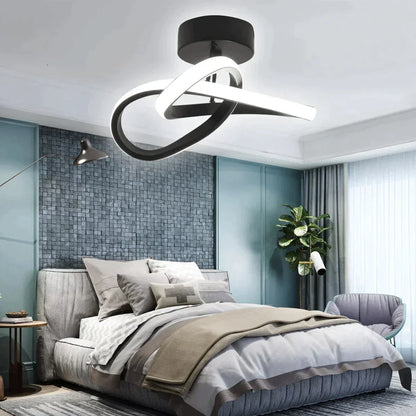 Quarto moderno com cama cinza, parede texturizada azul, poltrona e lustre LED preto com luz branca
