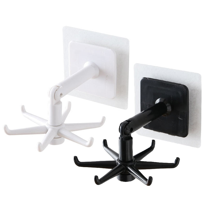 Suportes giratórios de parede em plástico branco e preto com ganchos para pendurar objetos