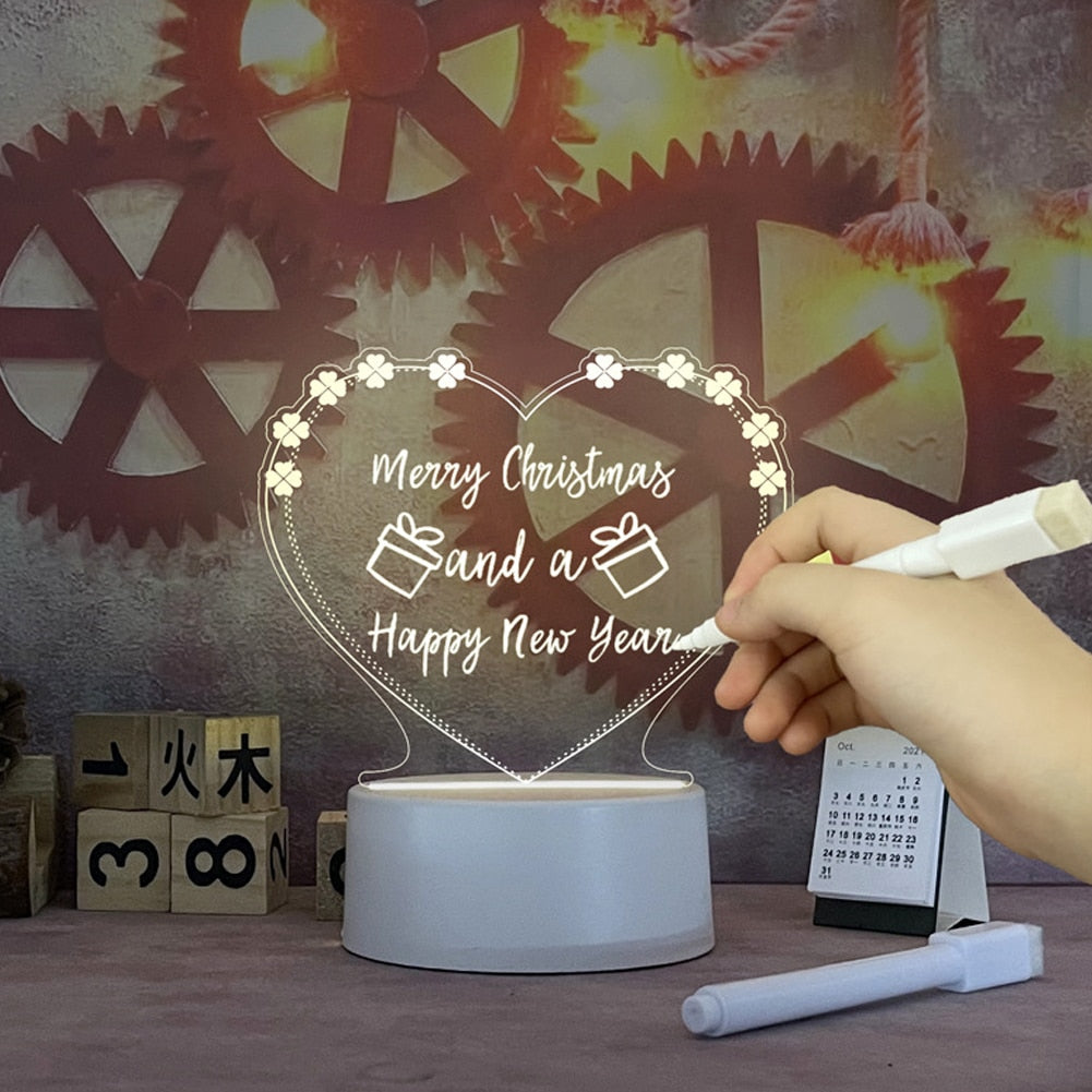 Luminária LED em forma de coração com mensagem de Natal e Ano Novo escrita manualmente