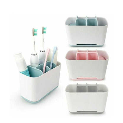 Organizadores de escovas de dentes em plástico branco com divisórias internas em azul, rosa e cinza