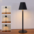 Abajur moderno preto com base redonda e iluminação suave em mesa de madeira