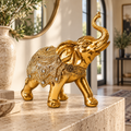 Elefante da Prosperidade dourado em ambiente sofisticado